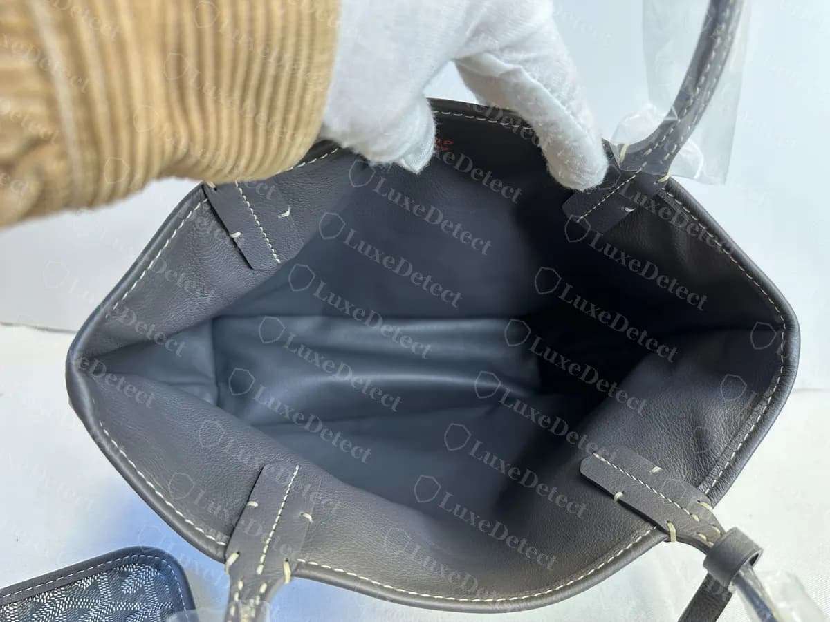Genuine reversible Anjou interior seen from inside, showing the leather side folded against the canvas side and the handles stitched through both