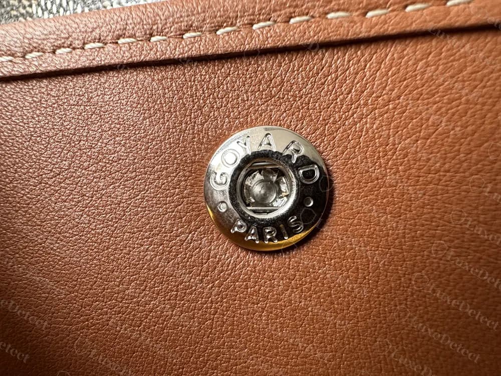 Genuine Goyard Anjou pouch snap engraved GOYARD PARIS around the rim, set into tan leather