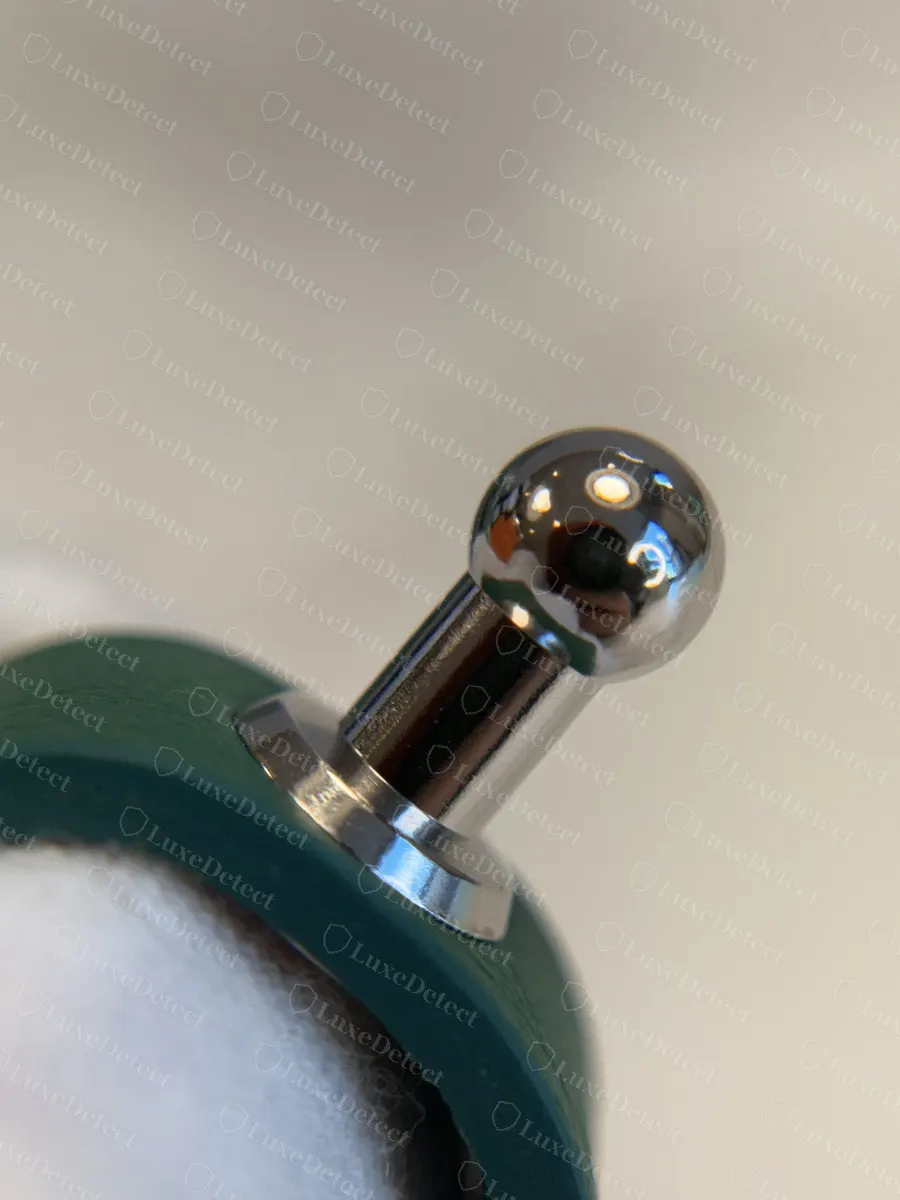 Genuine Goyard Anjou strap stud, a rounded chrome ball fitted flush into the leather strap