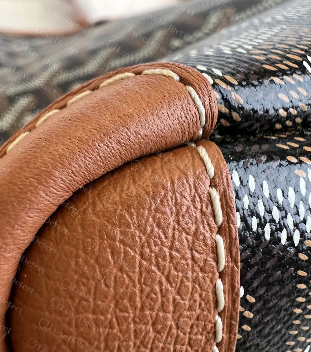 Genuine Goyard Artois base corner capped in tan leather with pale stitching