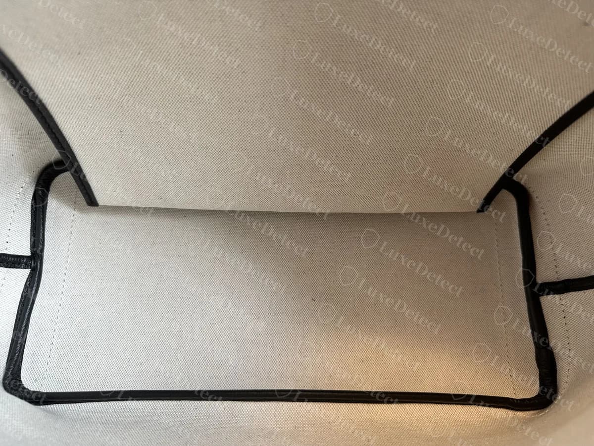 Genuine Goyard Artois interior: cream woven canvas lining with black piping along the seams