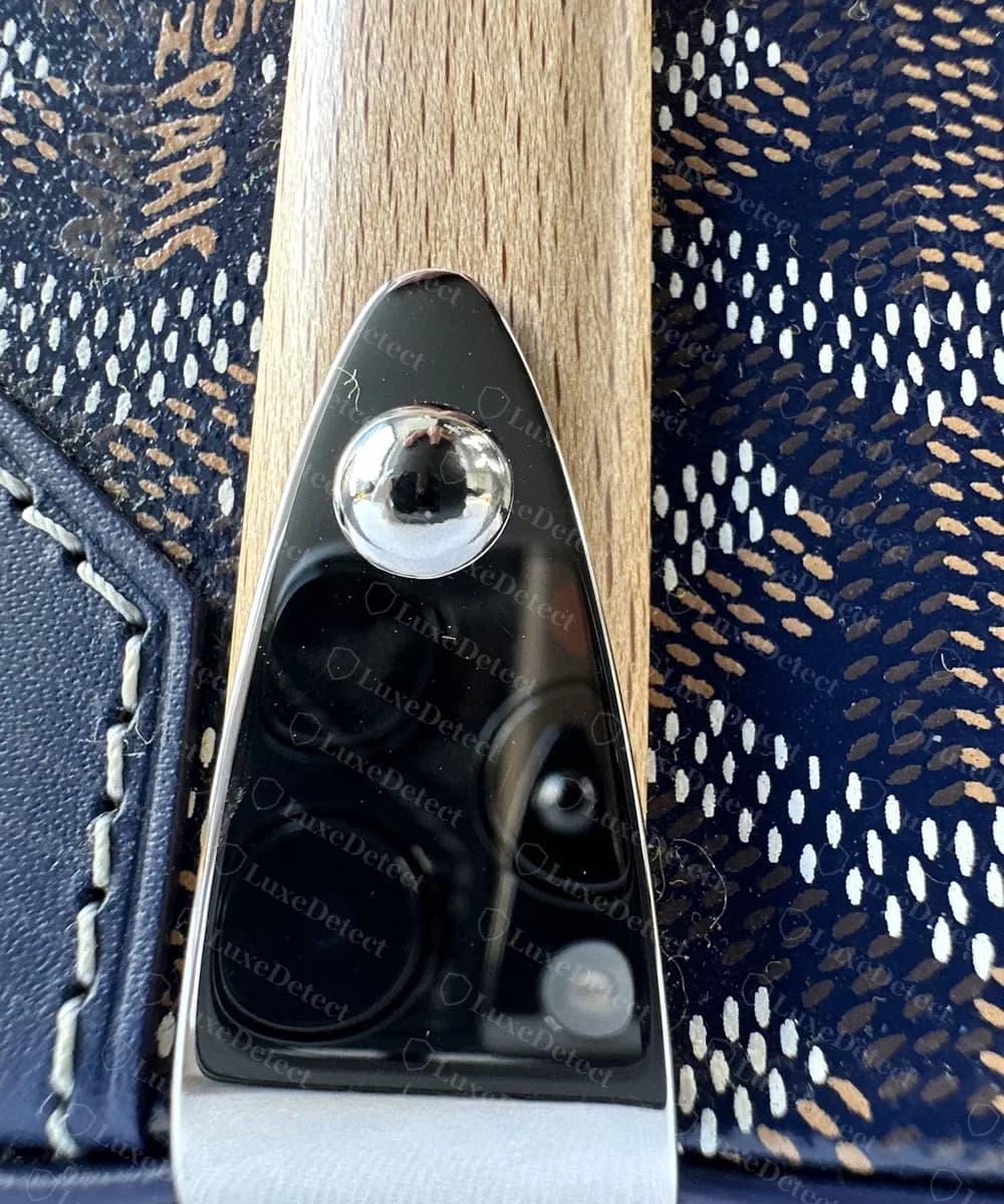 Genuine Goyard Saigon Structure side bar: pale wood with a pointed polished metal cap and domed rivet, with Goyardine canvas on either side