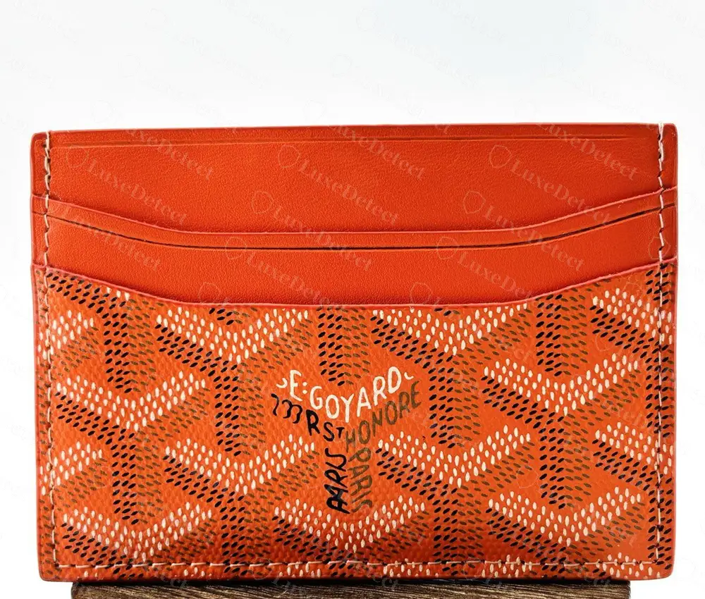 Counterfeit orange Goyard Saint-Sulpice-style card holder with a convincing chevron print and a correctly laid out three-layer logo