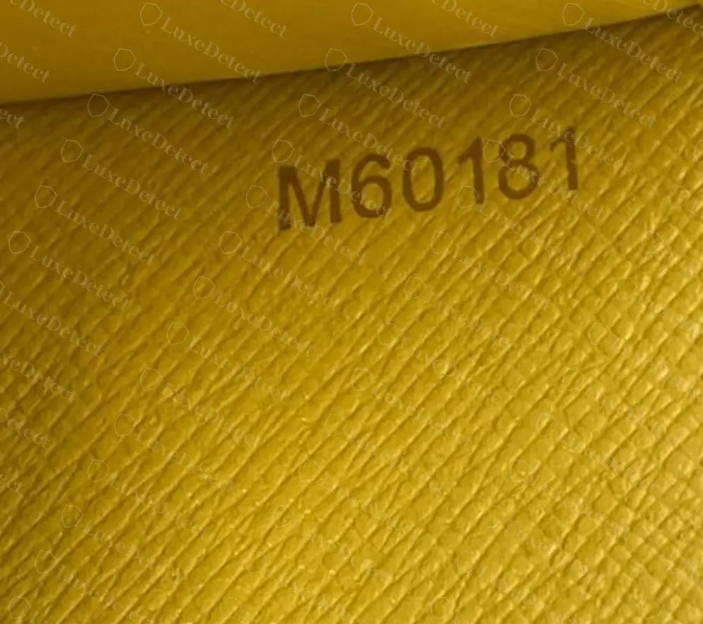 Counterfeit Goyard passport cover code M60181, one letter and five digits, found on two separate fake passport covers