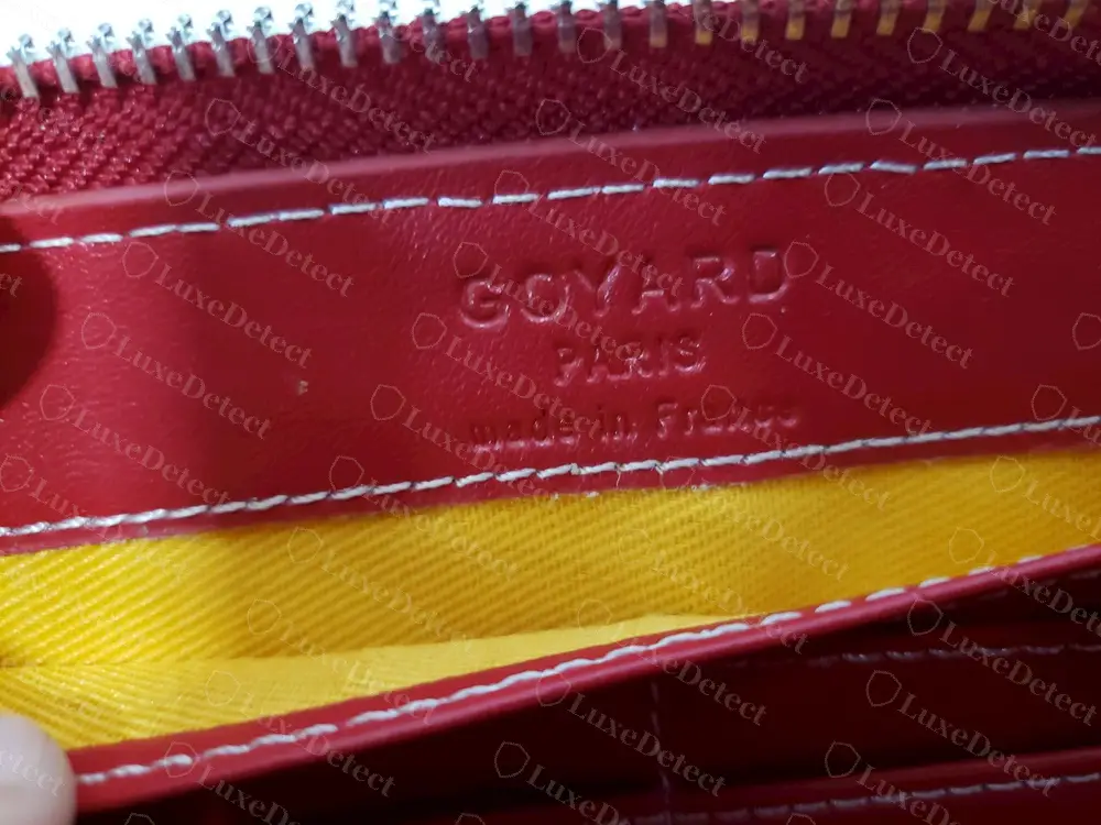 Counterfeit Goyard zip-around wallet: the stamp reads GOYARD and PARIS in capitals, then Made in France in mixed case