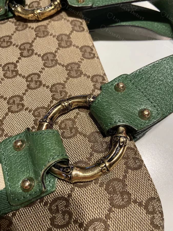 Genuine Gucci Bamboo hardware ring attaching the handle to a GG Supreme canvas body, green leather tab, correctly aligned canvas grid