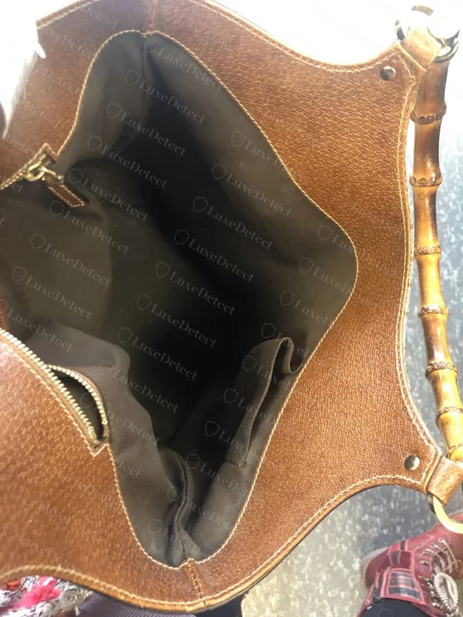 Genuine Gucci Bamboo interior, showing the smooth lining, even stitching, and the bamboo handle join from inside the bag