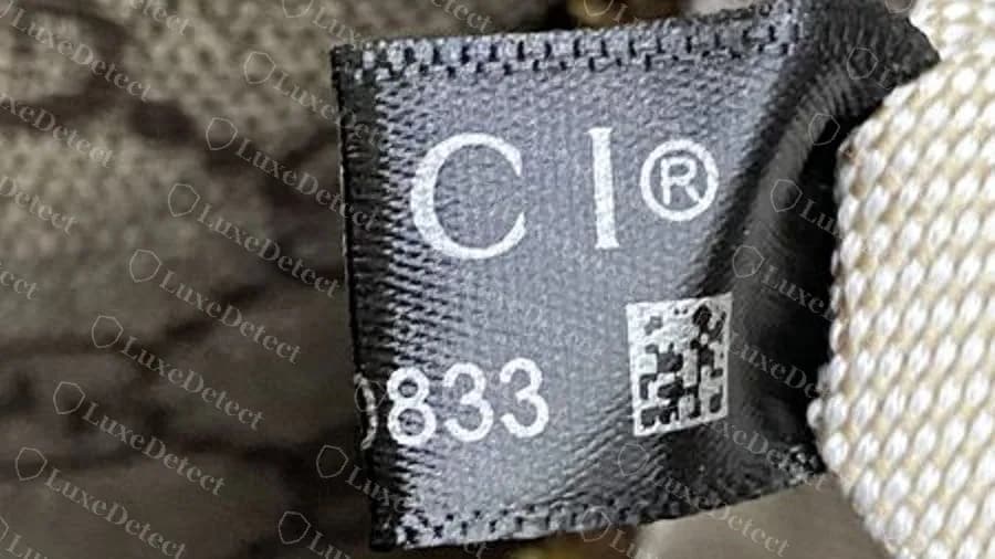 Fake bag that carries a normal-looking black label with a data matrix, so a good label does not clear a bag