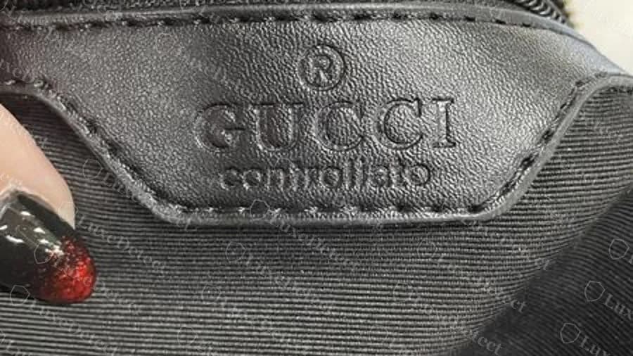 Fake patch stamped GUCCI controllato inside a modern bag