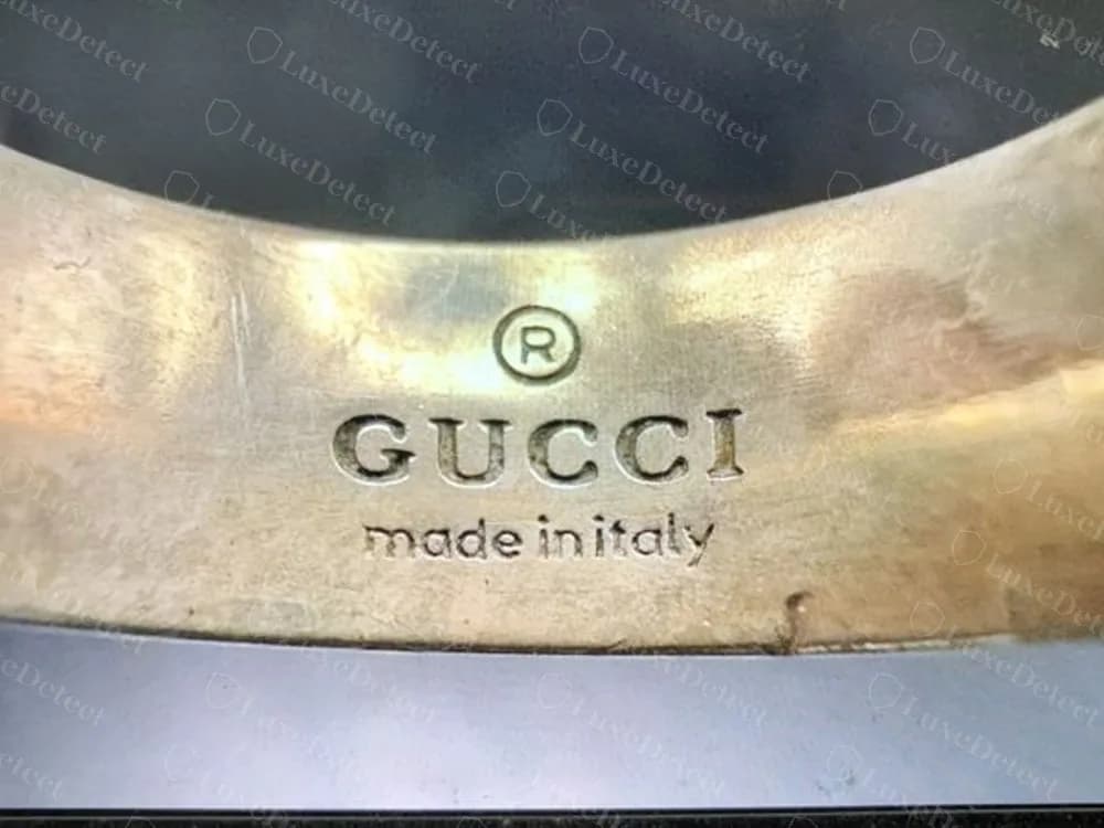 The same counterfeit Ghost ring with a spaced (R) GUCCI made in italy signature that looks correct
