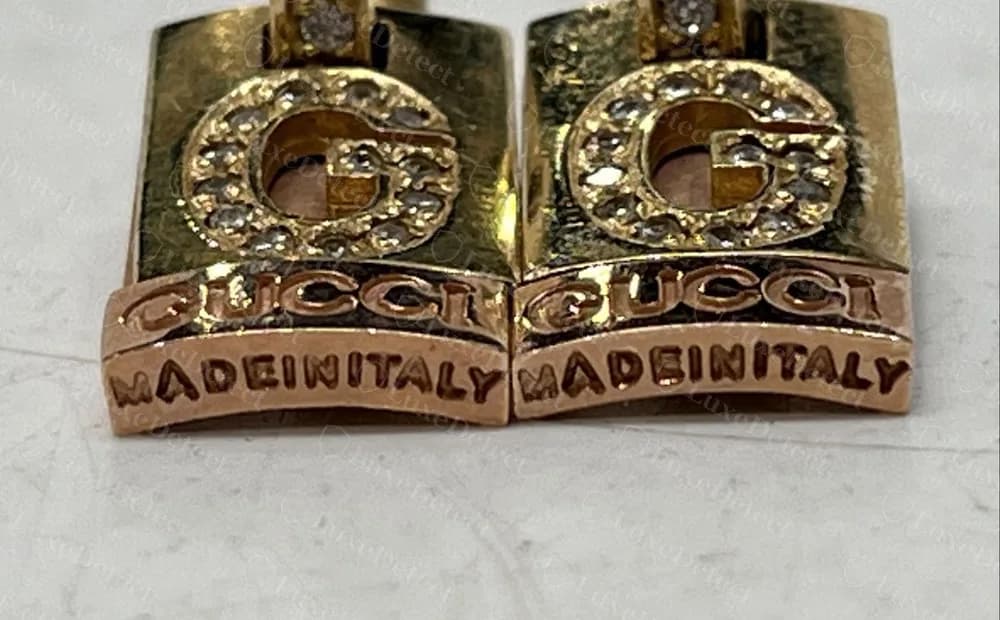 Pendientes colgantes Gucci falsos con MADEINITALY todo junto bajo el bloque GUCCI