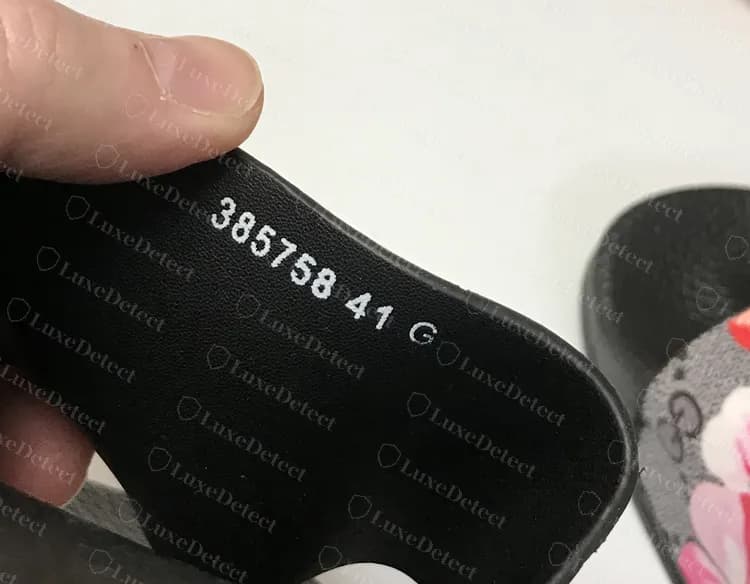Counterfeit GG Blooms slide: a second pair with 385758 41 G in white printed ink instead of a pressed code