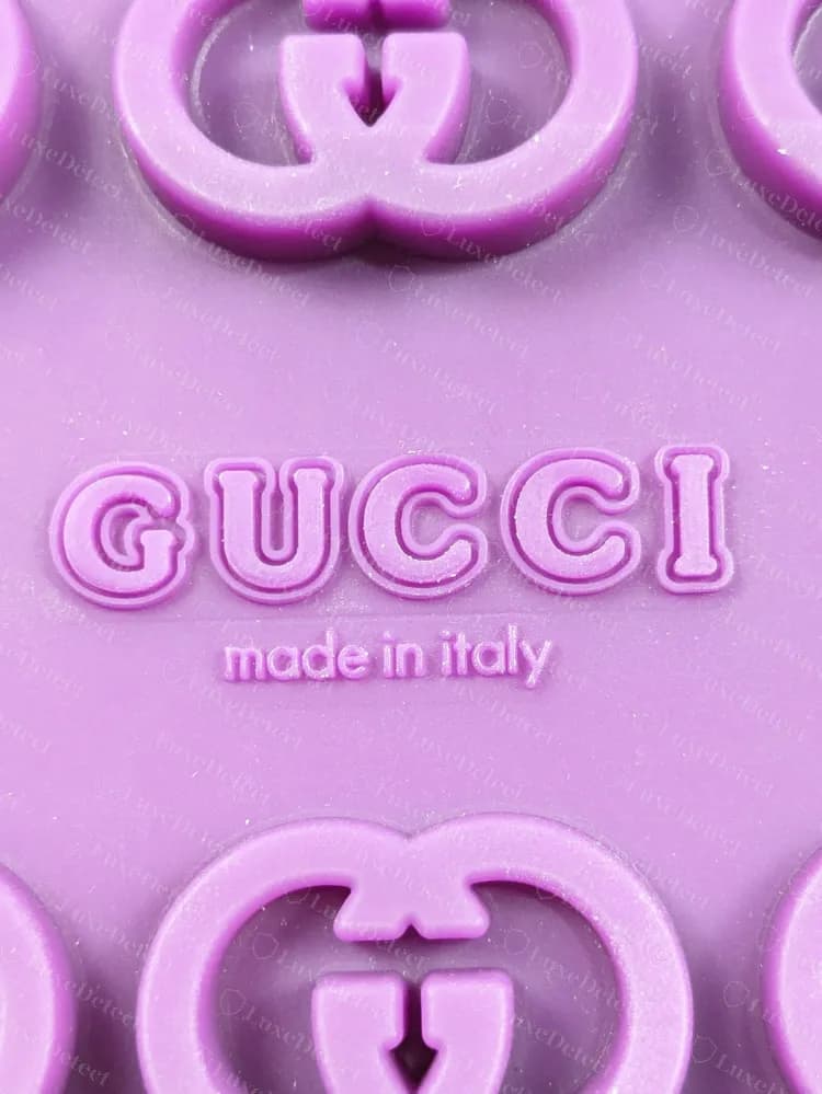 Genuine Interlocking G platform slide outsole: moulded GUCCI made in italy stamp inside a field of double-G lugs