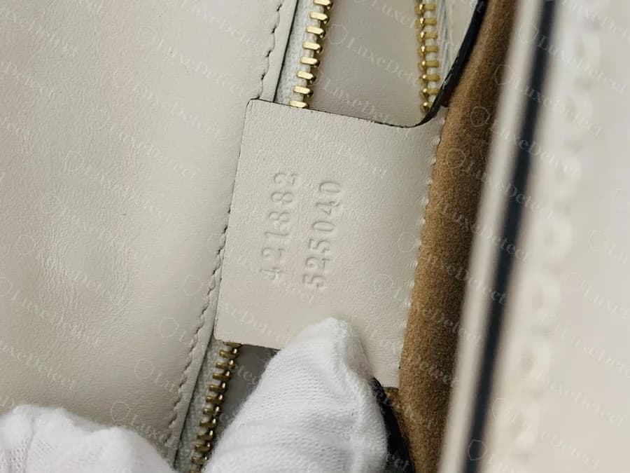 Genuine Sylvie small shoulder bag serial stamp, 421882 over 525040. Counterfeits in our archive carried this same number pair