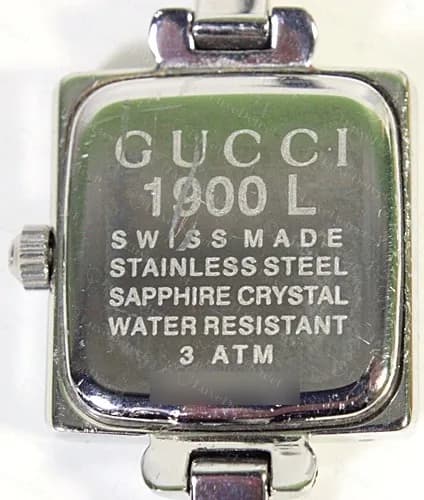 Genuine Gucci 1900 L caseback: GUCCI, model number and Swiss Made, stainless steel, sapphire crystal, water resistant 3 ATM wording, serial blurred