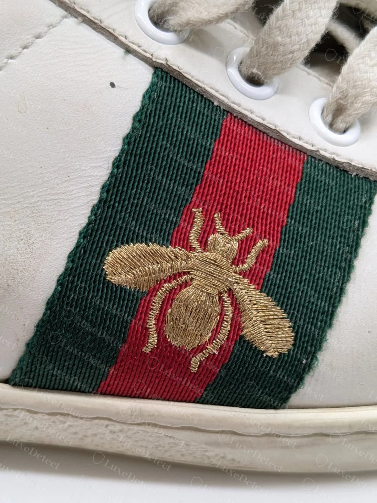 Genuine Gucci Ace bee (a worn pair) — the stitching still packed tight and flat, clean edges on the wings and body, slim legs and antennae
