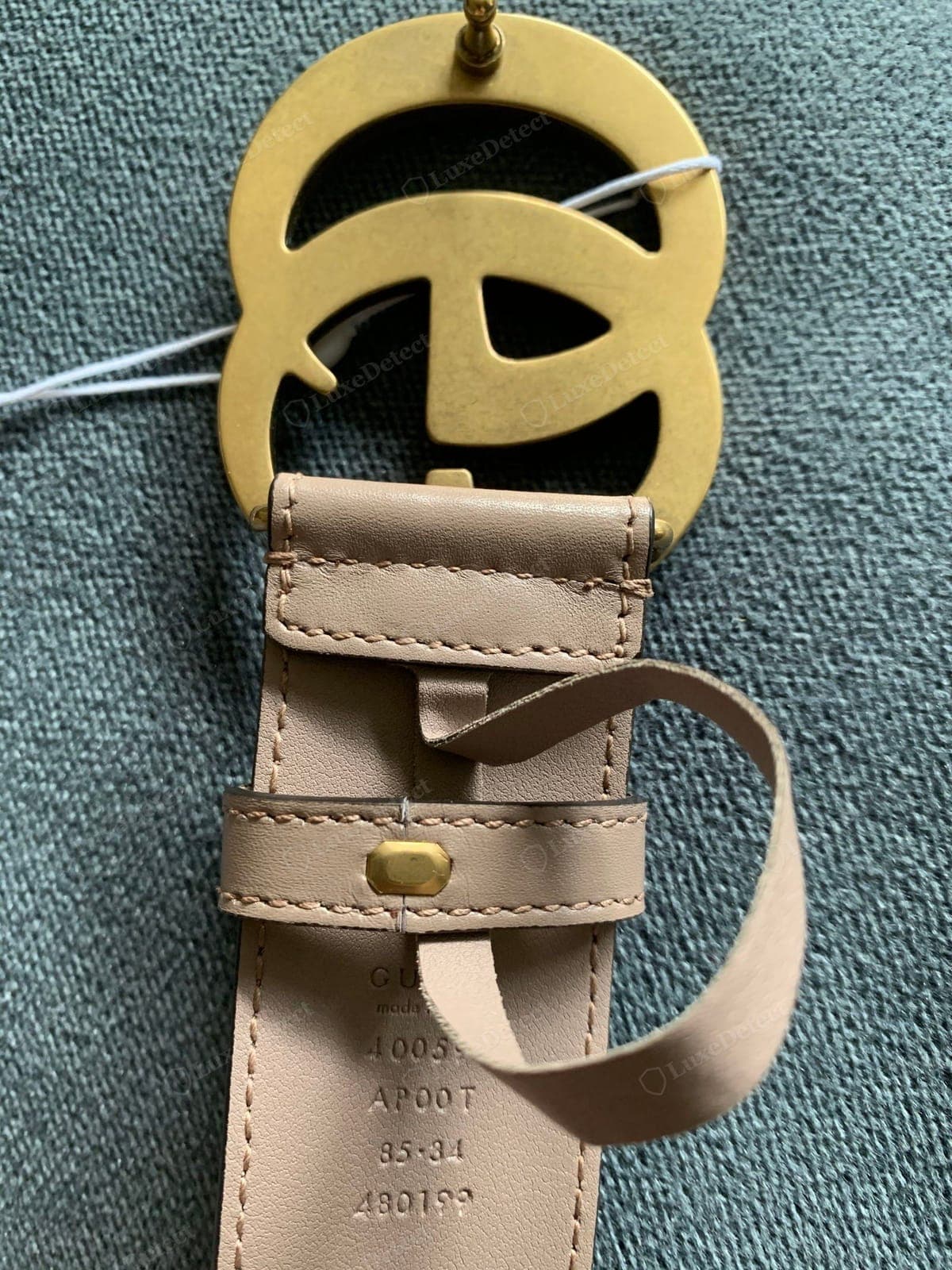 Genuine Gucci belt buckle reverse — the back of the buckle cleanly finished, any engraving crisp