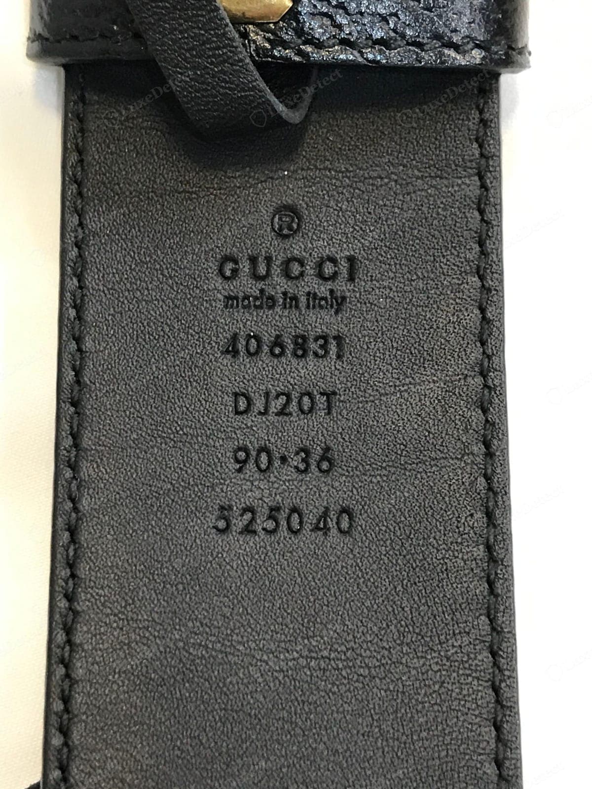Counterfeit Gucci belt size stamp — shallow, blobby, or wrong-font text, a capital M in "Made", a wrong size format