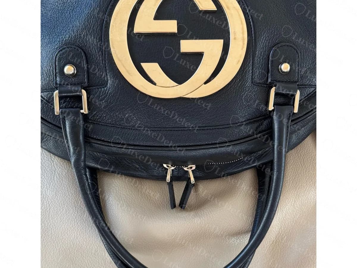Genuine black leather Blondie bowler bag: the large GG disc on the front, two rolled handles and a zip closure below