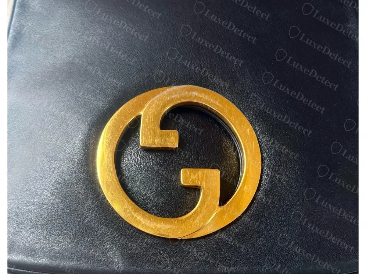 Genuine vintage Gucci Blondie in navy leather: a large flat gold-tone interlocking GG inside a ring, centred on the flap