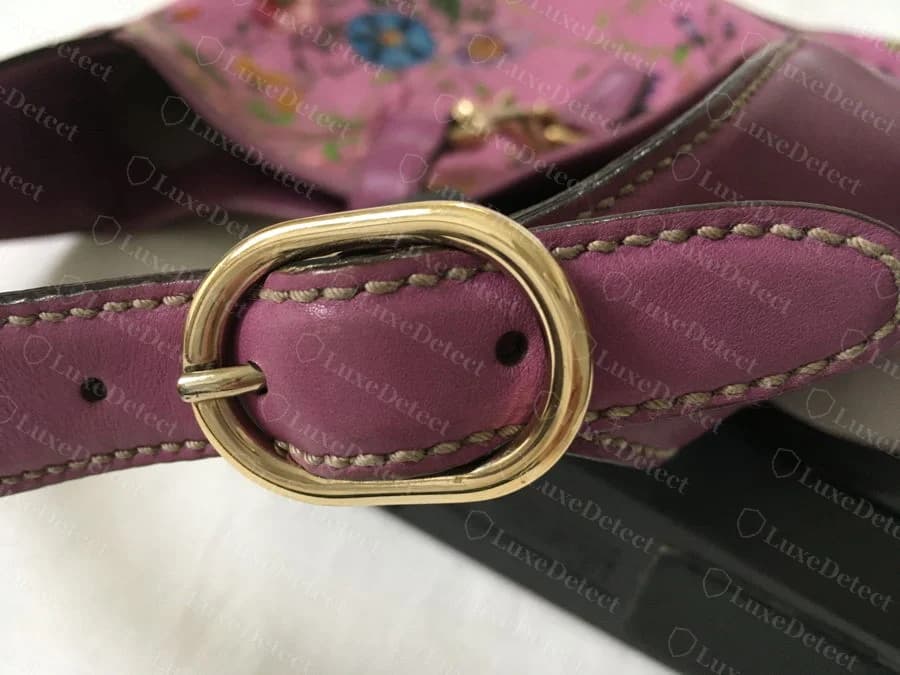 Authentic Gucci black QR-coded interior label on a Flora piece, the full GUCCI wordmark and style code visible and properly sized within the label panel