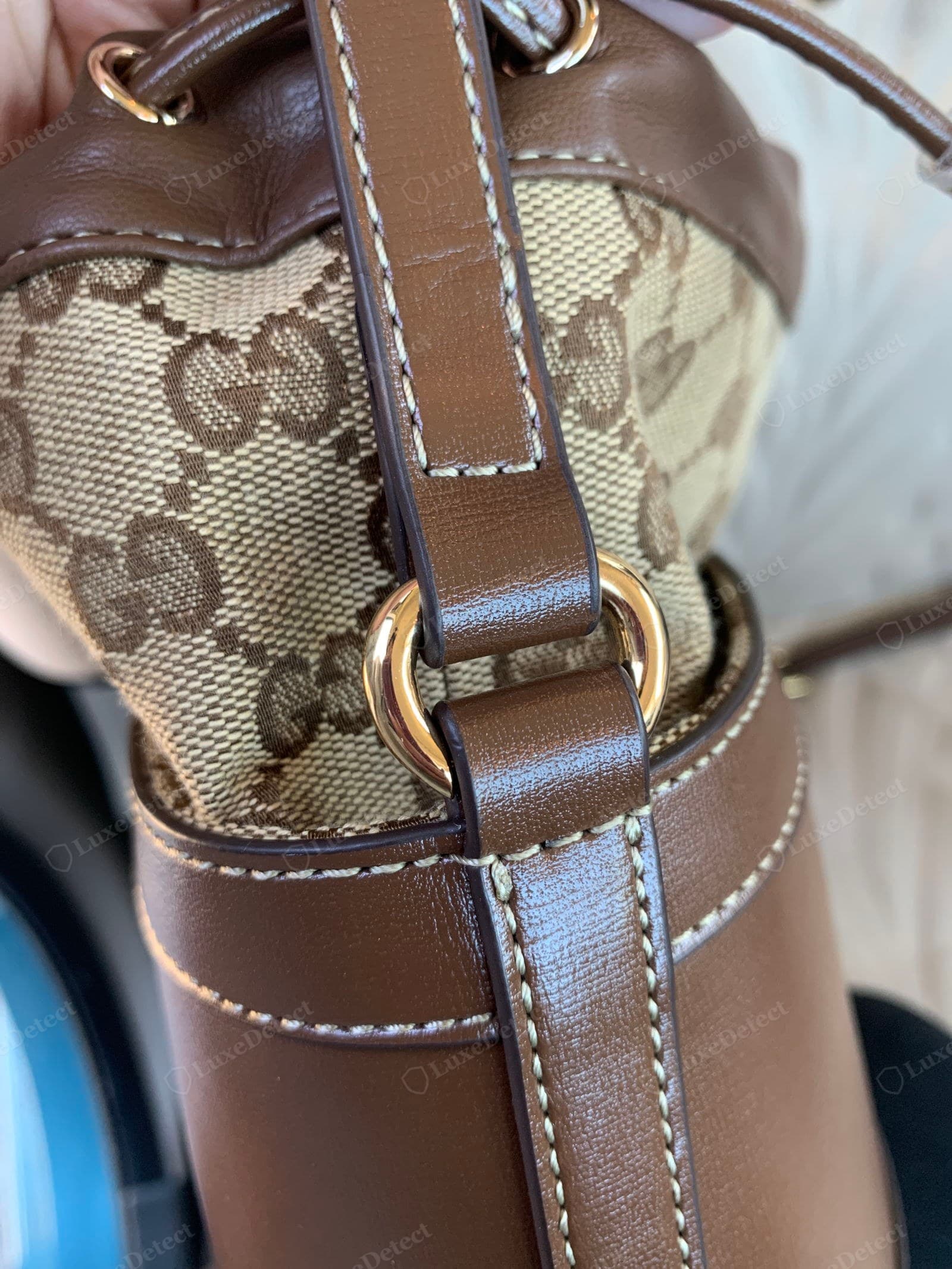 Counterfeit Gucci Horsebit 1955 — the stitching along a panel edge showing uneven length and a wandering line