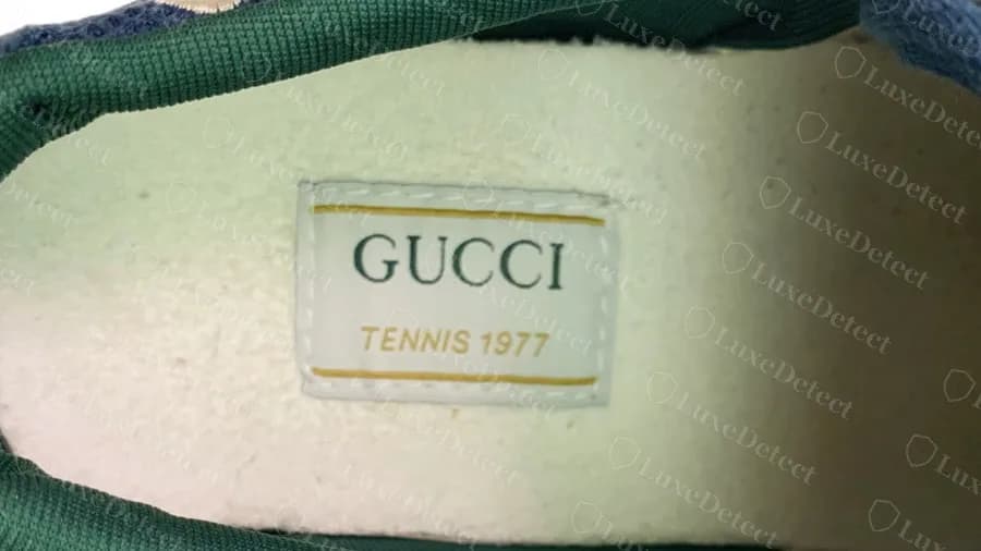 Counterfeit Gucci Tennis 1977 insole label: GUCCI and TENNIS 1977 in matching colours but no circled size anywhere on the label