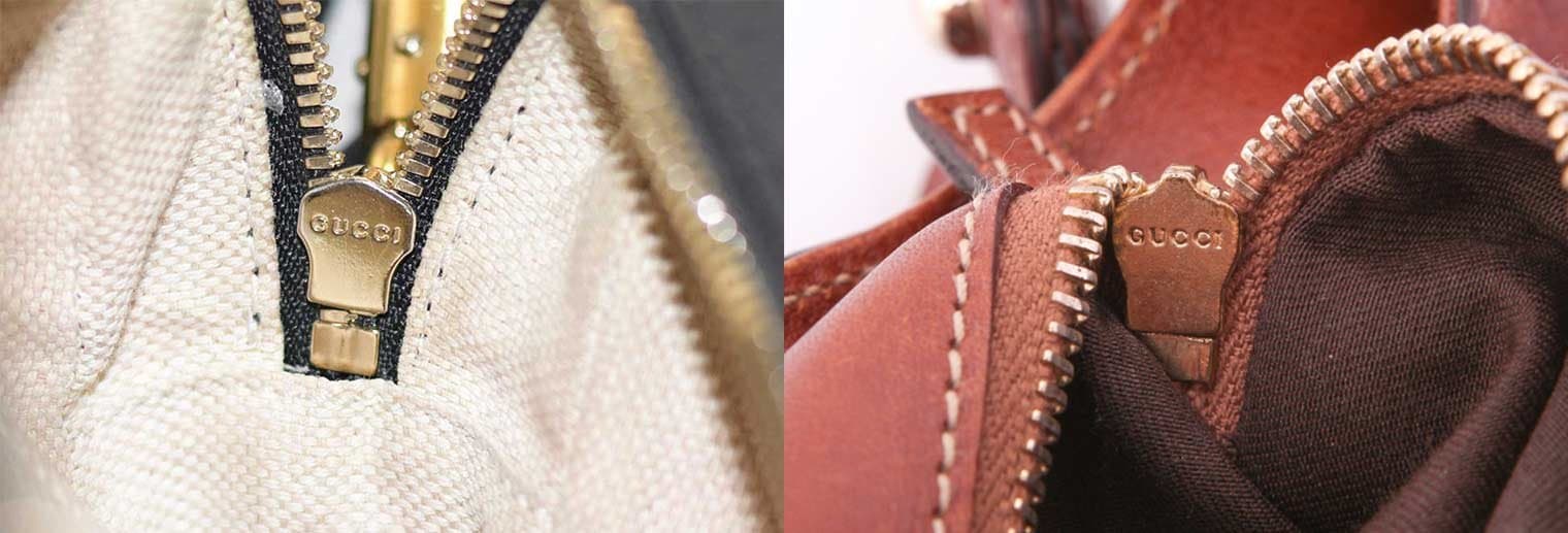 Gucci zipper slider close-up — "GUCCI" engraving clearly visible on the back of both pulls