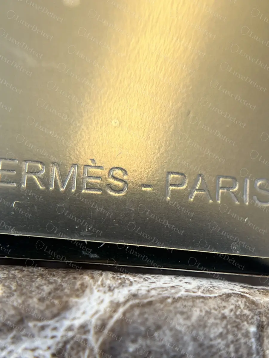 Steel Constance mirror engraved HERMÈS - PARIS with a Niloticus crocodile pull tab matching the bag