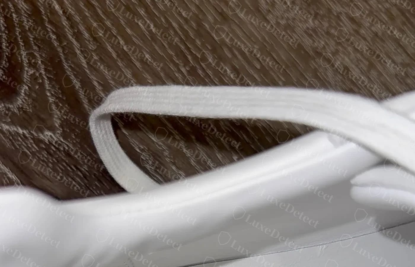 Interior lining code on a white pair — FR1 242810ZH 43 2511, printed into the leather along the inner quarter panel