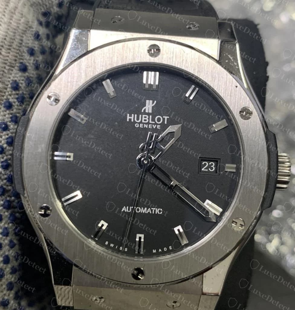 Genuine Hublot Classic Fusion in titanium — six bezel screws, each with a crisp H-shaped recess; note they are not all turned the same way