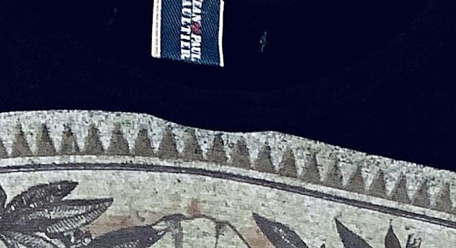 Genuine Jean Paul Gaultier woven label — "JEAN PAUL GAULTIER" in a clean, tight weave sewn straight into the garment seam