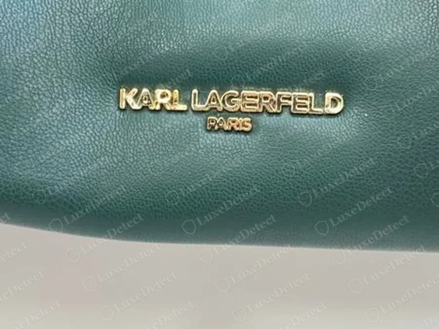 Genuine Karl Lagerfeld bag in dark green leather with a gold-tone metal nameplate reading KARL LAGERFELD with a smaller PARIS line beneath it