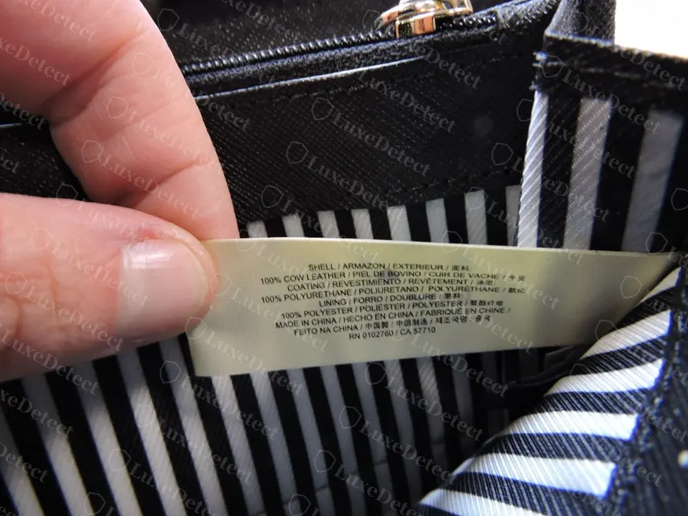 Genuine Kate Spade care label sewn into an interior seam, listing 100% cow leather shell, polyurethane coating, polyester lining, and a country of manufacture, in multiple languages