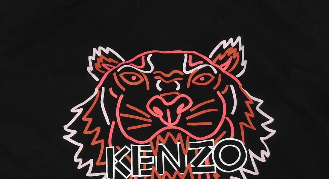 Cheap counterfeit Kenzo Tiger graphic — flat screen-printed with no raised texture at all, and visibly rougher, thicker outline linework than an embroidered edge