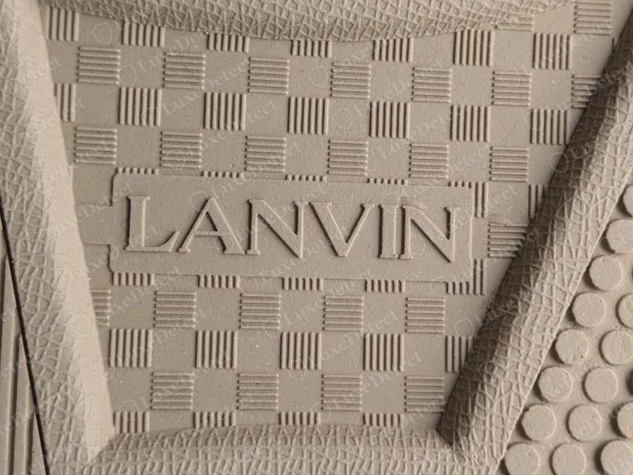 Genuine Lanvin Curb outsole detail, a block of chequerboard texture with LANVIN embossed in capitals inside a raised frame