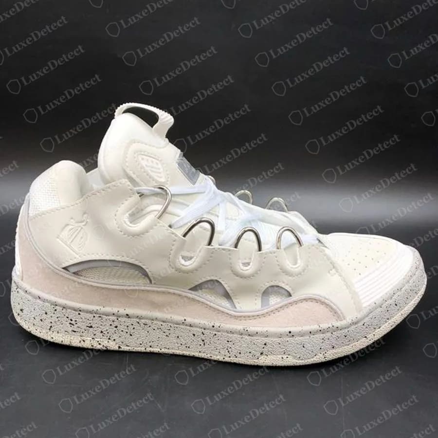 Genuine Lanvin Curb in white and pale grey with a speckled sole, seen from the side, showing the layered upper, looped eyelets and thick laces
