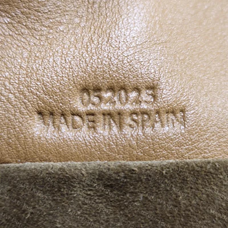 Genuine Loewe Flamenco interior with a numeric code pressed above MADE IN SPAIN on the leather
