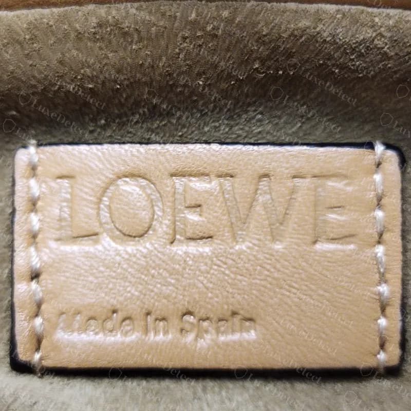 Genuine Loewe Flamenco interior label: a leather patch in the bag's colour embossed LOEWE and Made in Spain, sewn onto suede