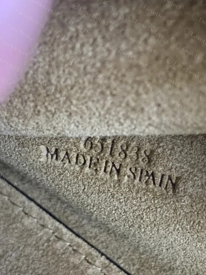 Genuine Loewe Gate lining showing a six-digit code pressed above MADE IN SPAIN