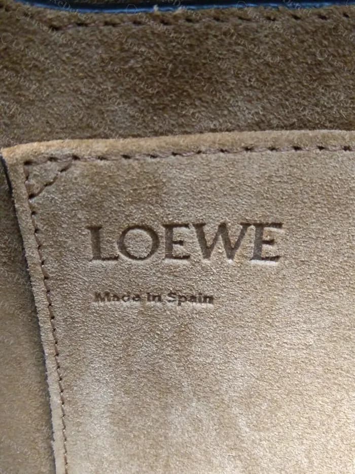 Genuine Loewe Gate suede lining with LOEWE and Made in Spain pressed into a stitched patch