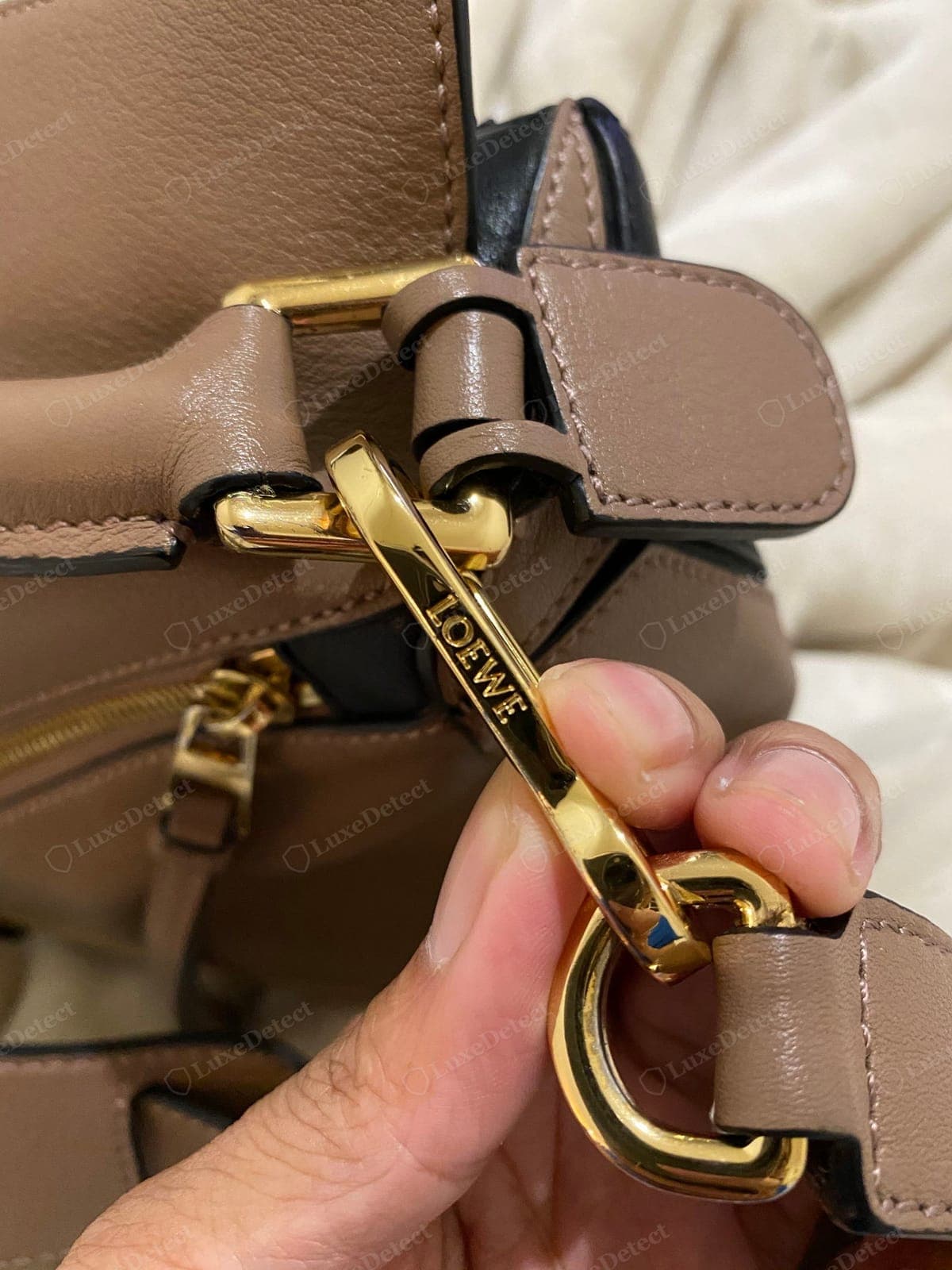 Genuine Loewe Puzzle hardware — the Anagram cast crisply into a solid buckle, even plating, a precise fit