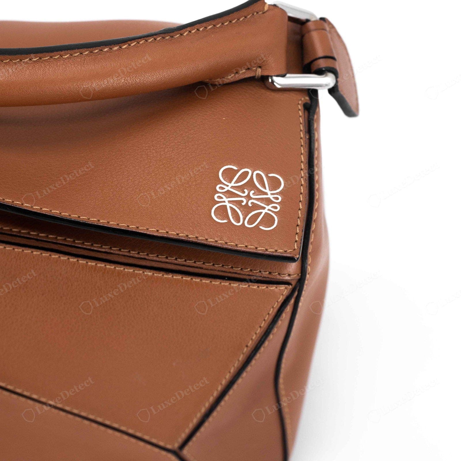 Genuine Loewe Puzzle stitching — even heavy waxed thread following the panel seams, consistent length, tight at the points