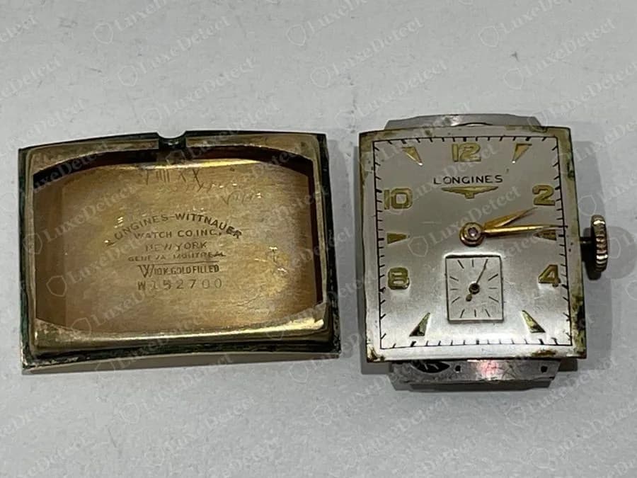 Genuine vintage Longines-Wittnauer case interior stamped LONGINES-WITTNAUER WATCH CO INC NEW YORK GENEVA MONTREAL with a gold-filled mark and a number, beside the matching movement and a silver dial with a small seconds subdial