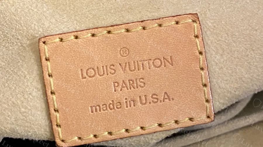 Genuine Artsy interior tag reading made in U.S.A., same layout and stitching