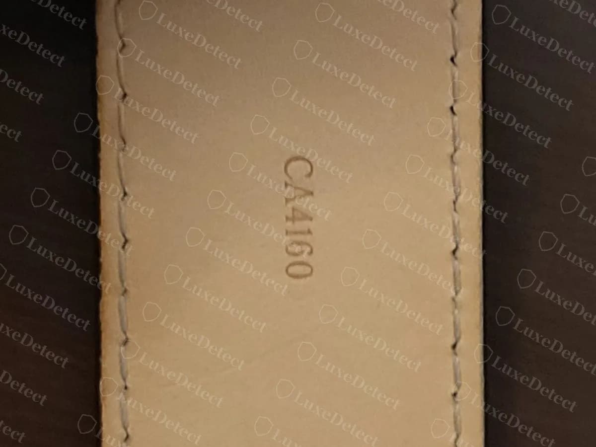 Genuine Louis Vuitton belt date code CA4160 stamped on the natural leather underside of the strap, decoding to week 46 of 2010