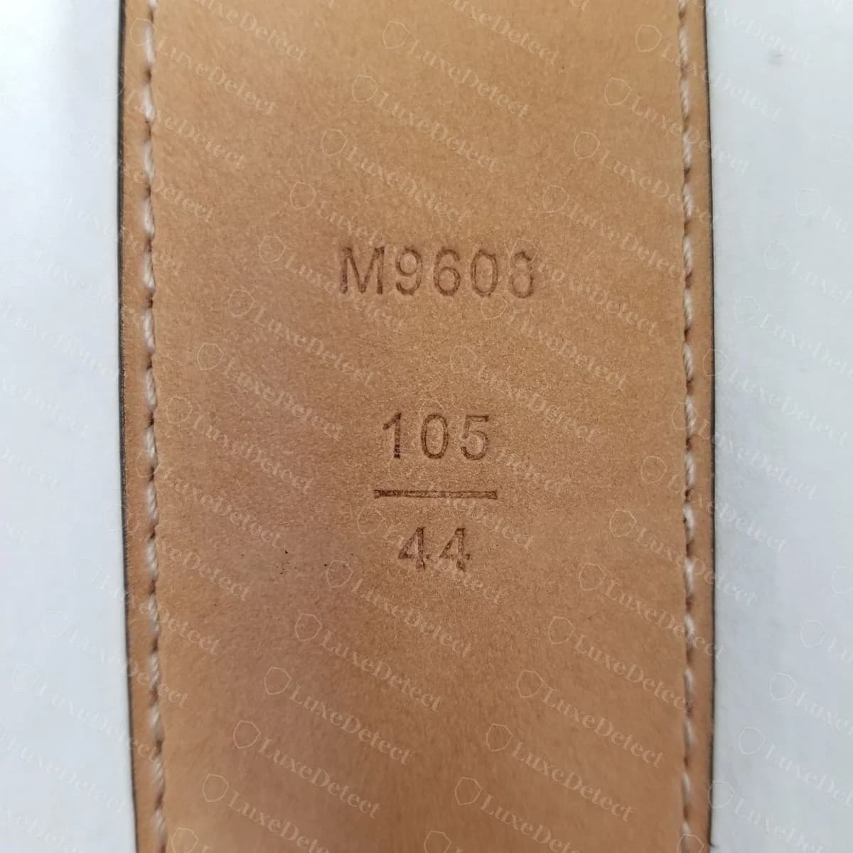 Counterfeit LV belt stamped M9608 and 105 over 44, a centimetre and inch pair that does not match
