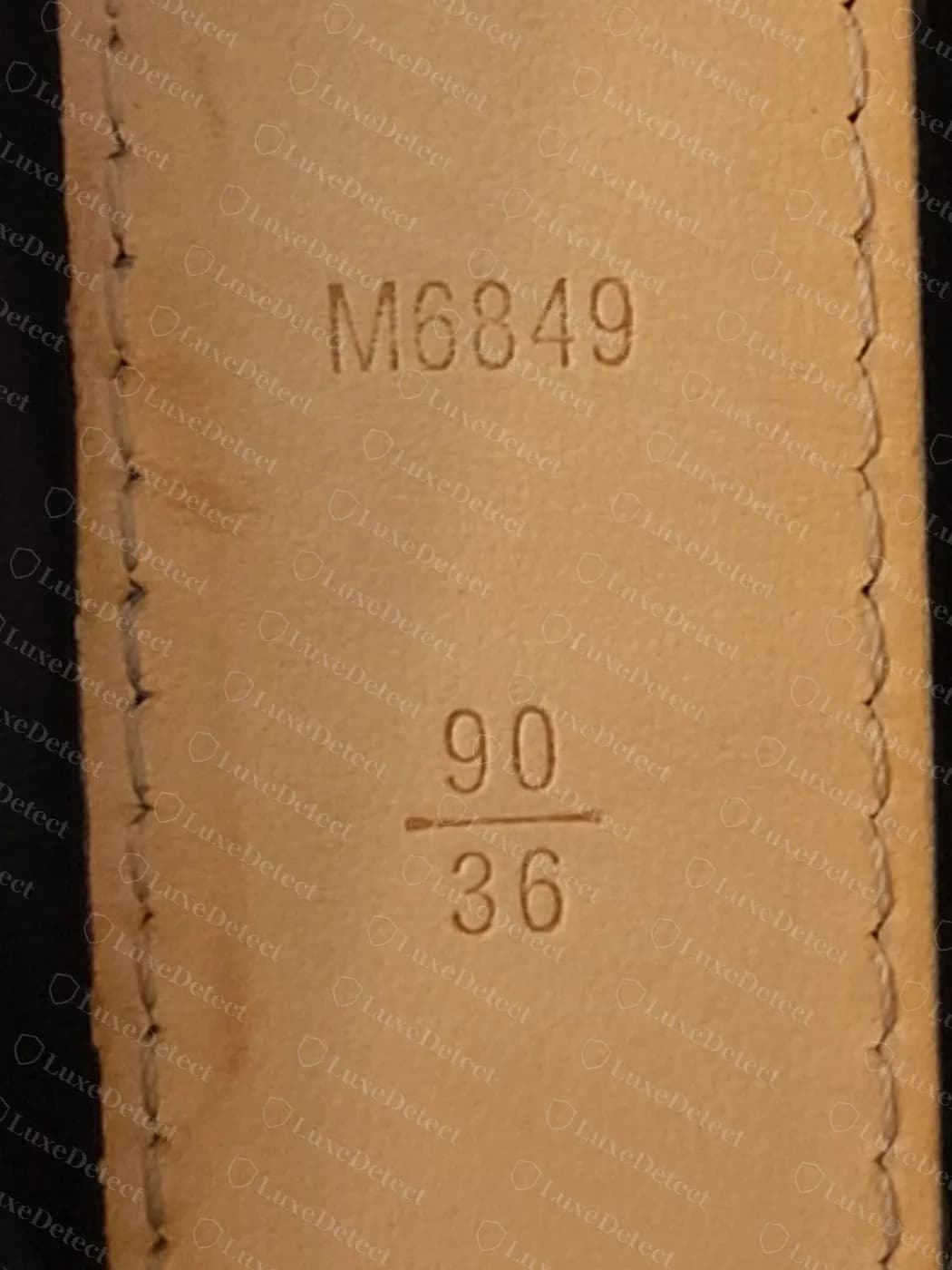Genuine Louis Vuitton belt size stamp: model number M6849 above a 90 over 36 size fraction, centimetres on top and inches below