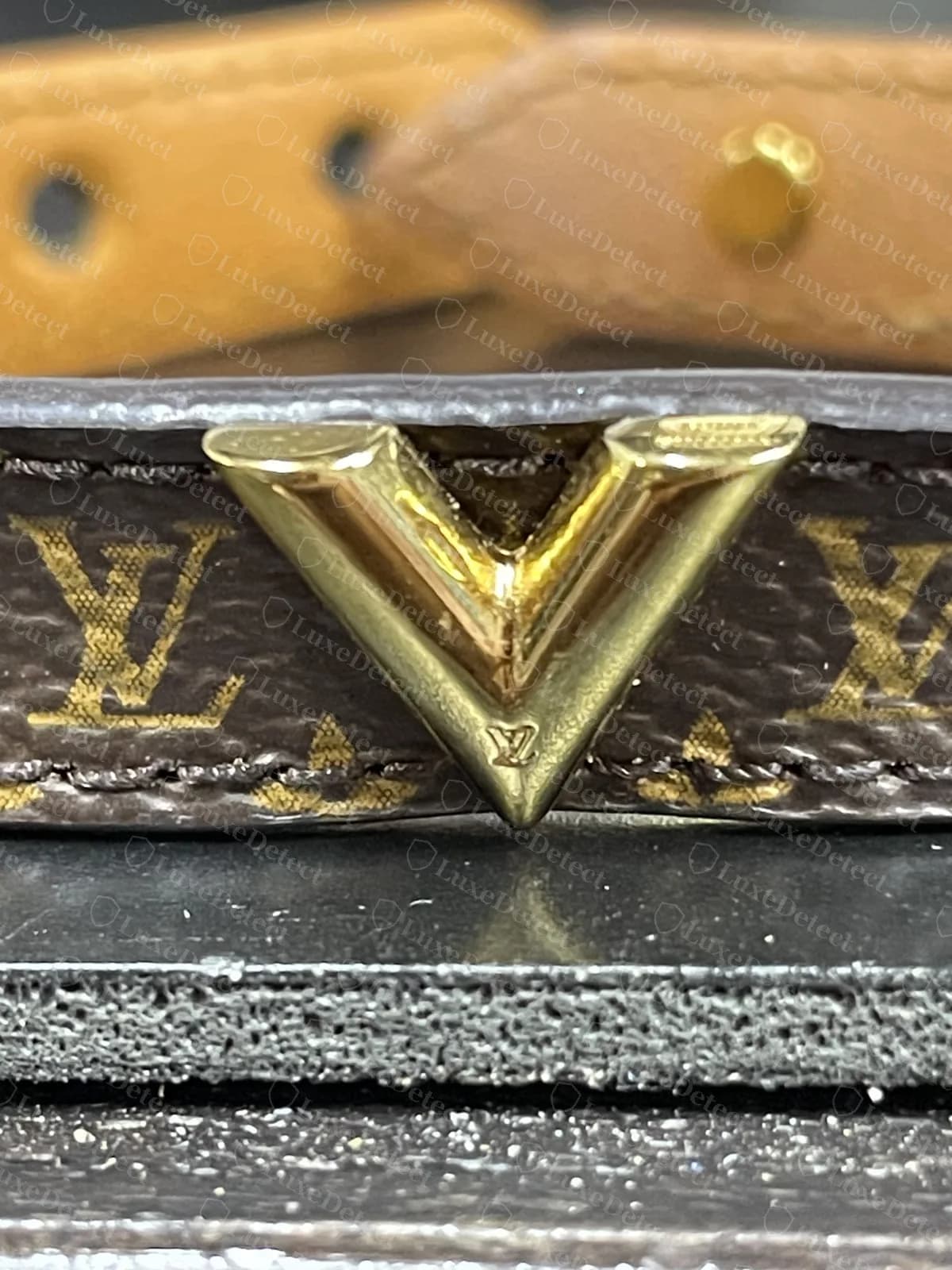 Authentic Essential V bracelet in Monogram canvas, the gold-tone V centred on the band