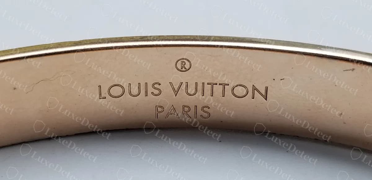 Authentic Nanogram cuff inner band: registered mark, LOUIS VUITTON and PARIS stacked and centred